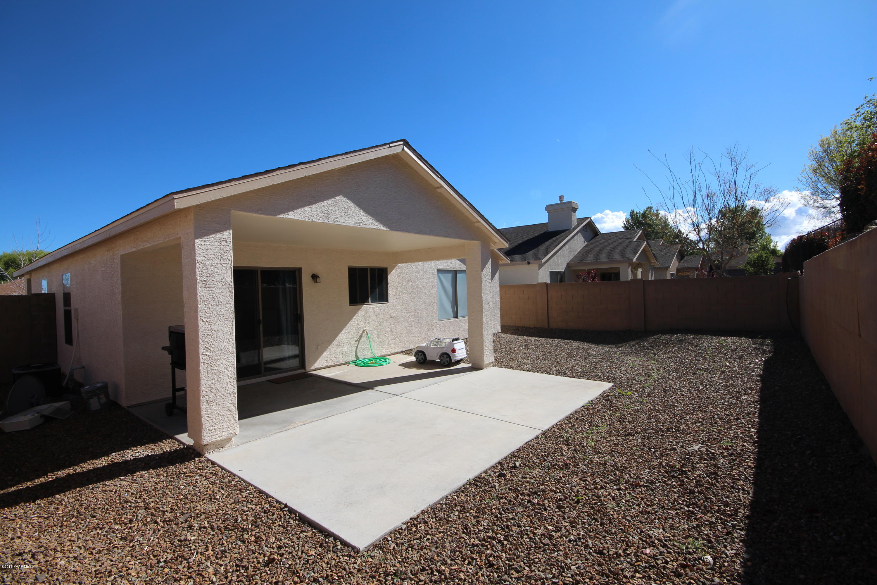 7449 East Plateau Ridge Road Prescott Valley, AZ 86315 - Photo 15 of 17 a front view of a house with a yard