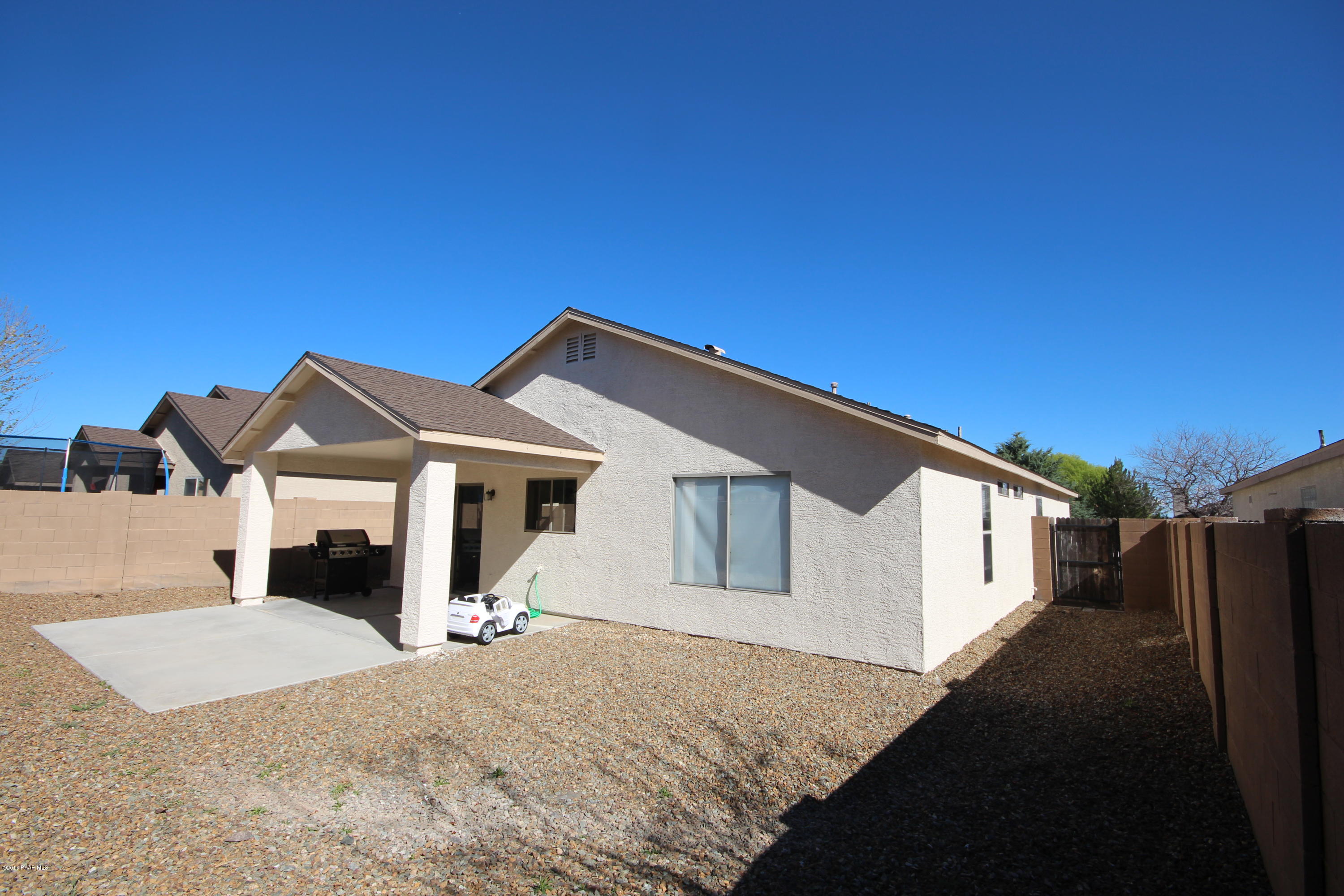 7449 East Plateau Ridge Road Prescott Valley, AZ 86315 - Photo 16 of 17 a front view of a house with a yard