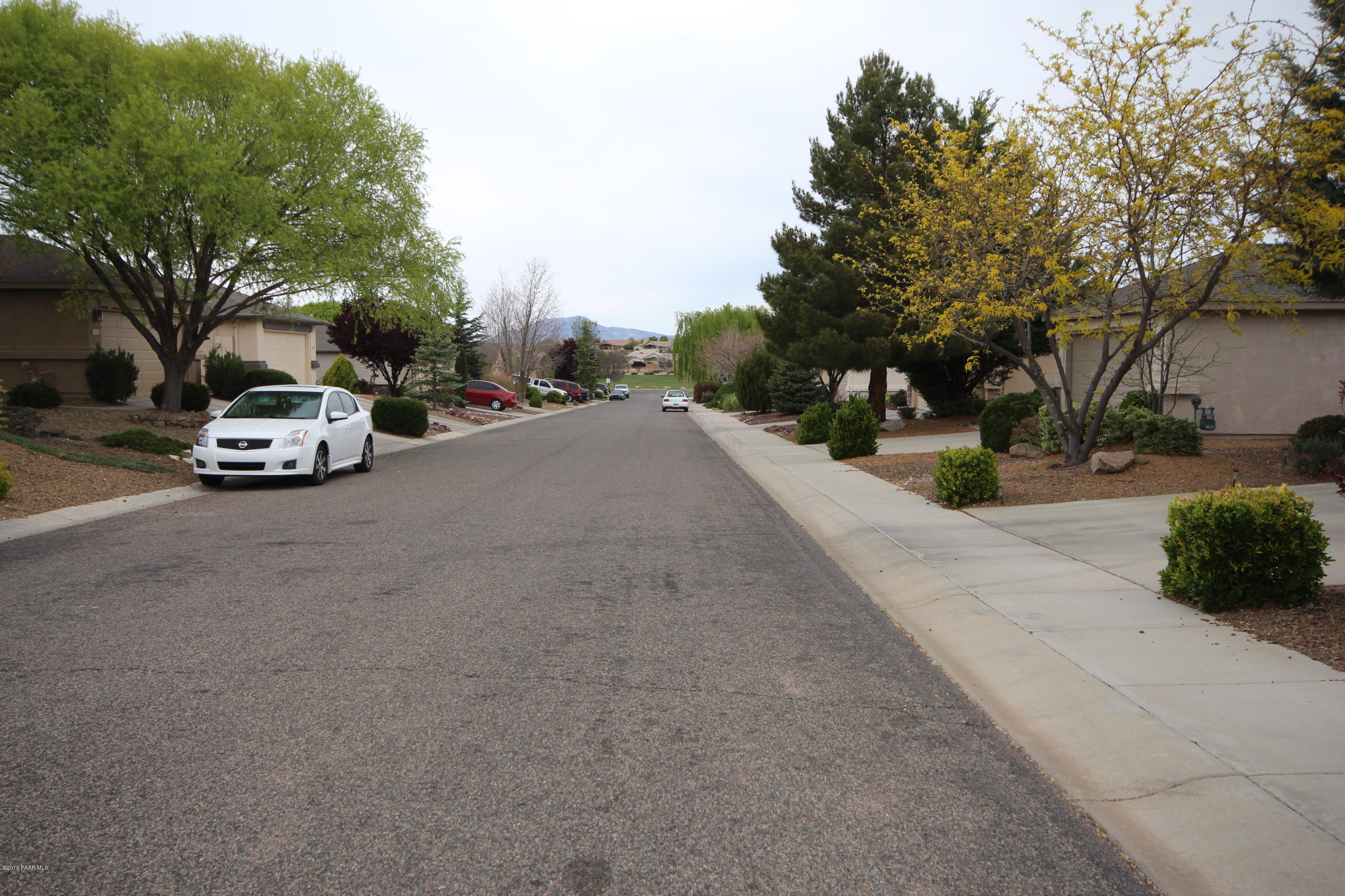 7449 East Plateau Ridge Road Prescott Valley, AZ 86315 - Photo 17 of 17 a view of street with parked cars
