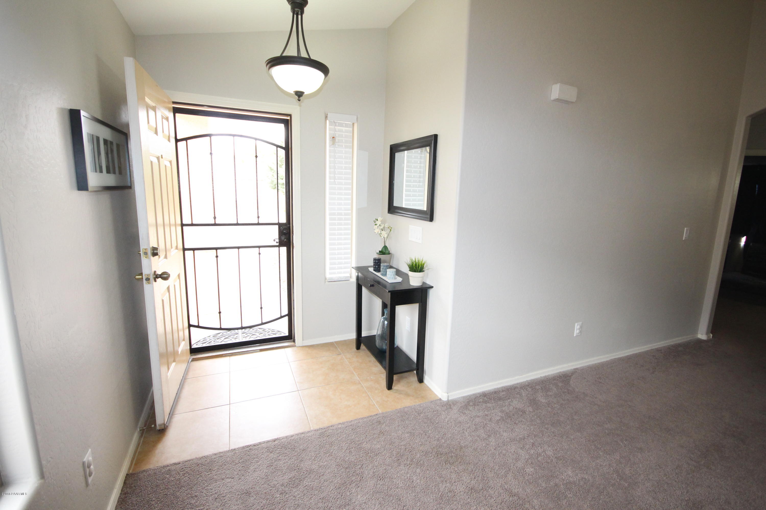 7449 East Plateau Ridge Road Prescott Valley, AZ 86315 - Photo 3 of 17 a view of a livingroom with furniture and windows