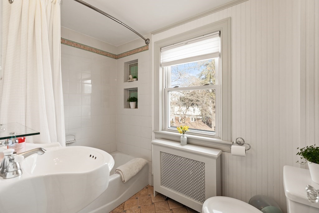 38 Magnolia Road Milton, MA 02186 - Photo 21 of 34 a bathroom with a sink a window and a toilet
