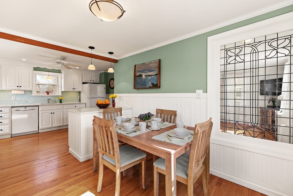 38 Magnolia Road Milton, MA 02186 - Photo 8 of 34 a view of a dining room with furniture and wooden floor