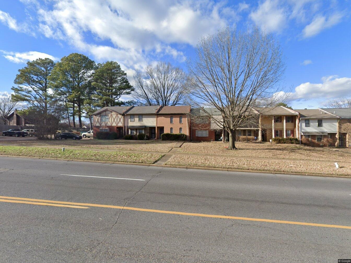 6398 Macon Road Memphis, TN 38134 - Photo 1 of 1 a front view of residential houses with yard and trees