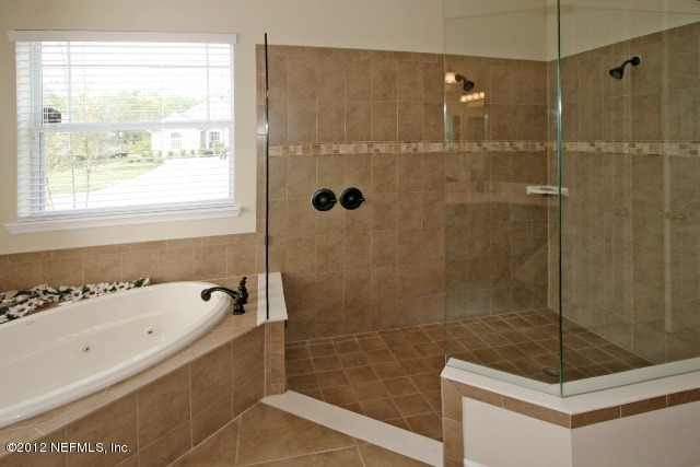 1300 Powis Road St. Augustine, FL 32095 - Photo 20 of 41 a bathroom with a bathtub and a shower