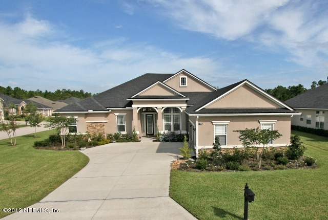 1300 Powis Road St. Augustine, FL 32095 - Photo 2 of 41 a front view of a house with a yard