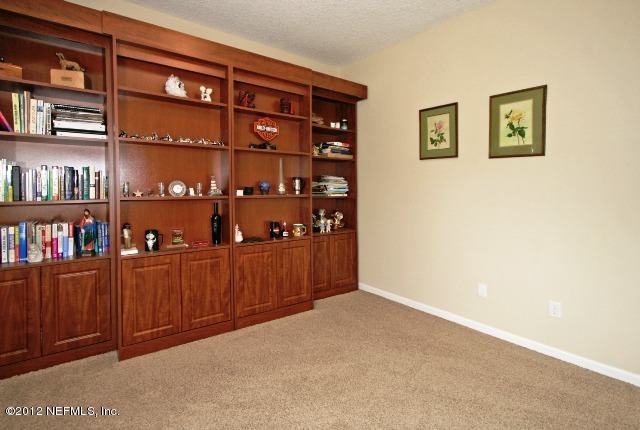 1300 Powis Road St. Augustine, FL 32095 - Photo 23 of 41 a room with bookshelf