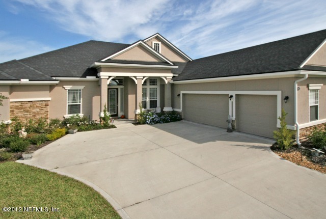 1300 Powis Road St. Augustine, FL 32095 - Photo 4 of 41 a front view of a house with garden