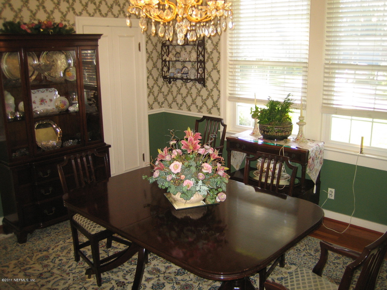 3053 Jolly Road Jacksonville, FL 32207 - Photo 4 of 17 a view of a dining room with furniture window and outside view