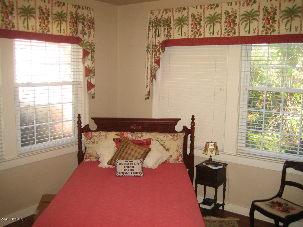 3053 Jolly Road Jacksonville, FL 32207 - Photo 9 of 17 a bed sitting in a bedroom next to a window