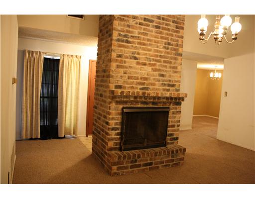 3305 Meadow Ridge Drive Corpus Christi, TX 78418 - Photo 2 of 9 a view of an empty room with a fireplace