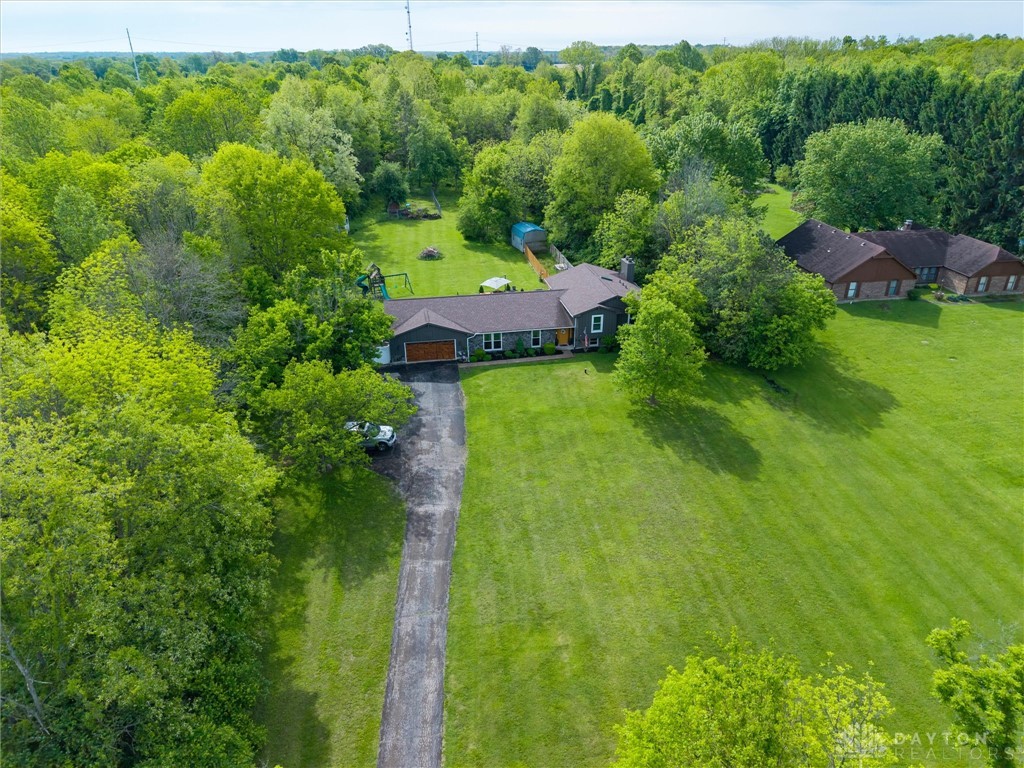 2165 Stewart Road Xenia, OH 45385 - Photo 26 of 59 This expansive estate offers ample green space and a welcoming residence, perfect for tranquil living.