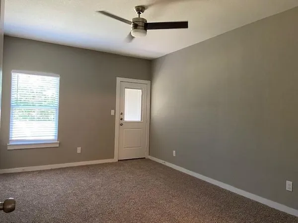 en empty room with windows