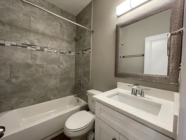 a bathroom with a sink toilet and a bathtub