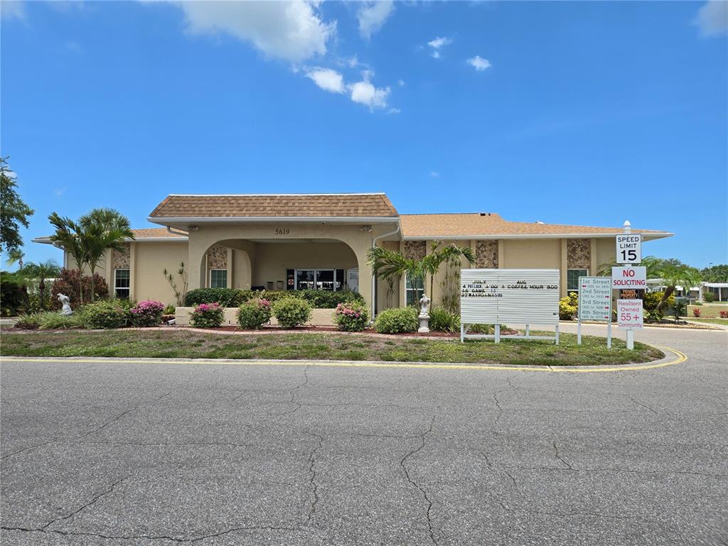 5619 Bayshore Road, Unit 435 Palmetto, FL 34221 - Photo 47 of 56 a view of a house with a yard and plants