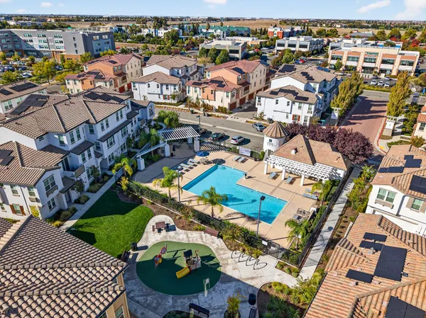 an aerial view of a houses with yard