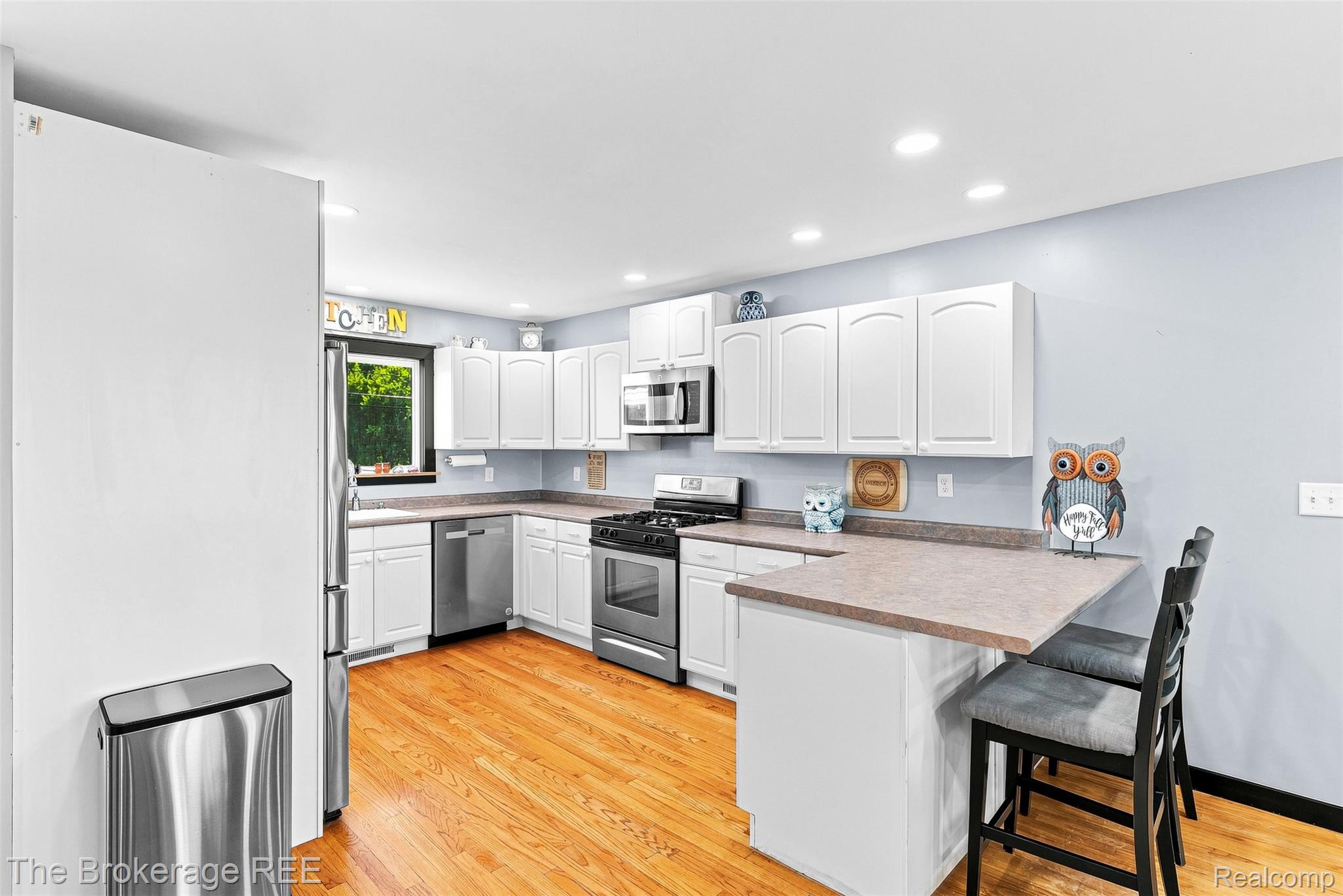 4443 North Gale Road Davison, MI 48423 - Photo 17 of 36 Recessed lighting illuminates this kitchen featuring light wood-finish flooring, white cabinetry, and stainless steel appliances