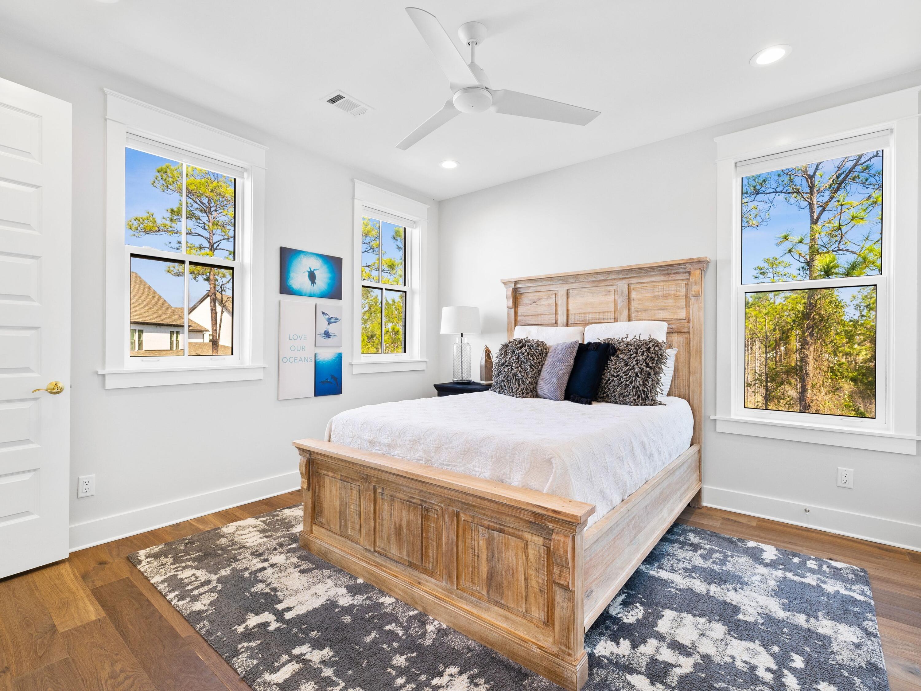 425 Ridgewalk Circle Santa Rosa Beach, FL 32459 - Photo 14 of 22 a bedroom with a bed and painting on the wall