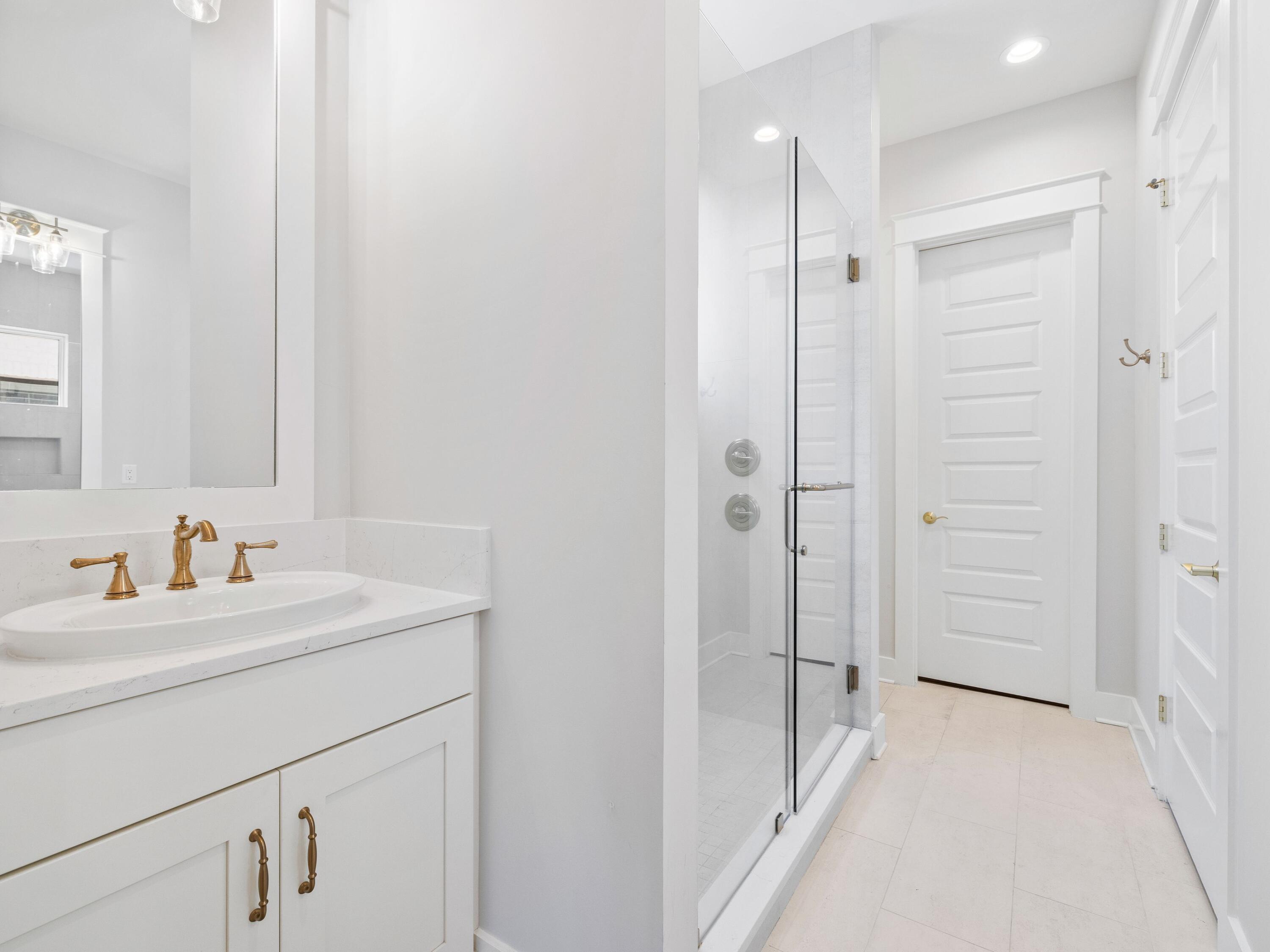 425 Ridgewalk Circle Santa Rosa Beach, FL 32459 - Photo 10 of 22 a bathroom with a sink a toilet and shower