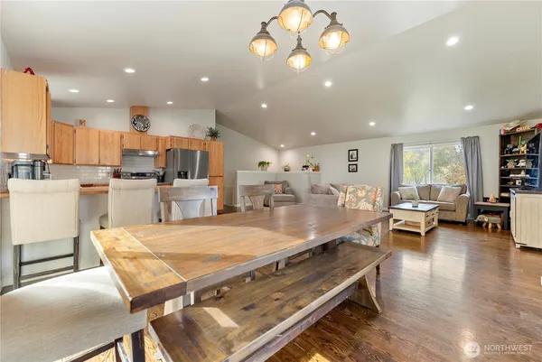 a large kitchen with a table and chairs in it