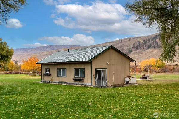 a front view of house with yard and green space