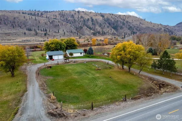 a view of a swimming pool with a yard