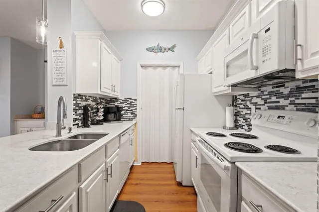 a kitchen with a sink and cabinets