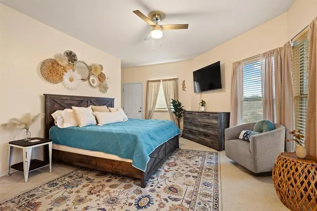 a bedroom with a bed and glass walk in closet