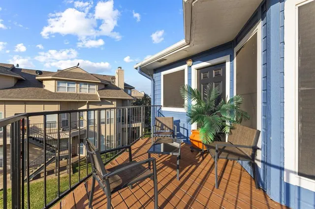 a living room with fireplace furniture and a flat screen tv