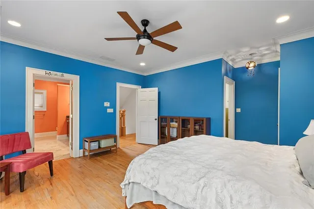 a spacious bathroom with a granite countertop tub sink shower and mirror