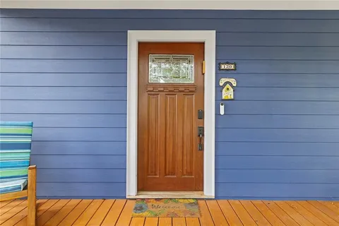 a view of entryway and gallery with wooden floor