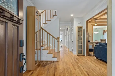 a view of wooden floor and windows in a room