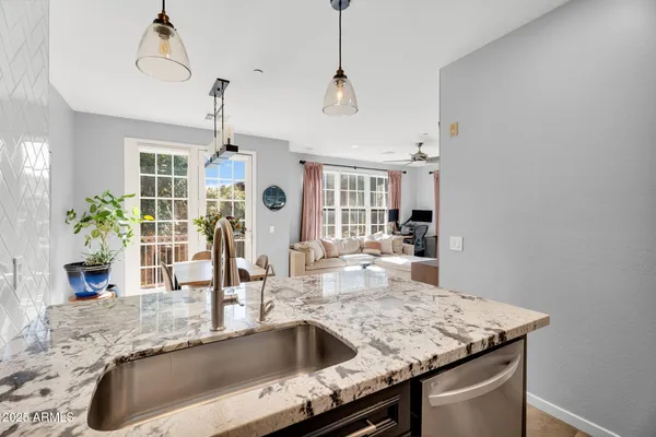 a kitchen with a sink a counter space and appliances