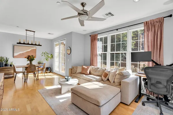 a living room with furniture and a large window