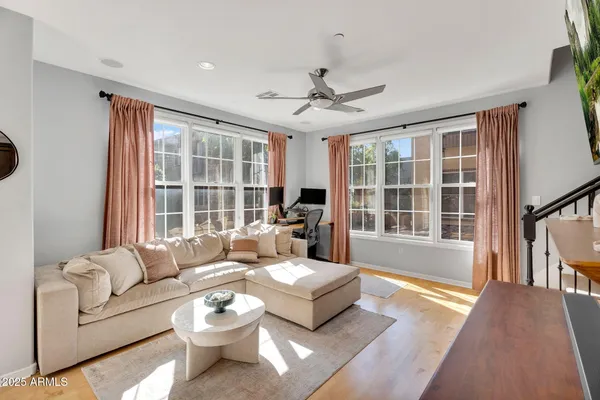 a living room with furniture and a large window
