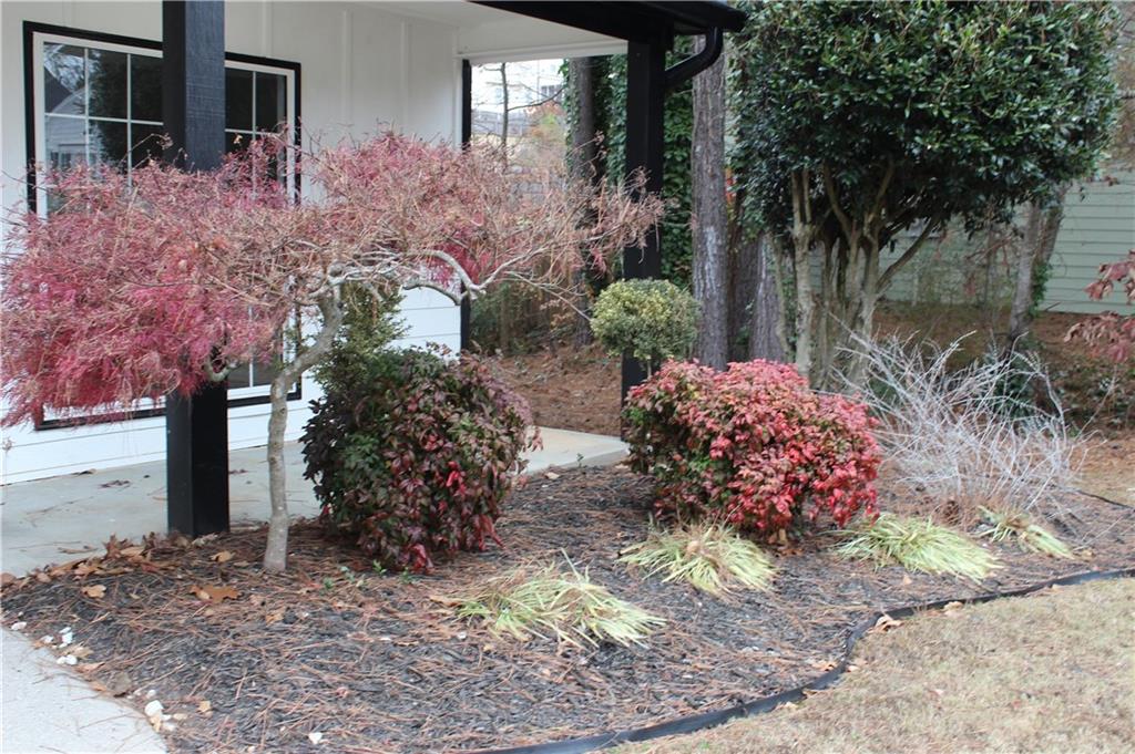 1250 Springmont Court Lawrenceville, GA 30043 - Photo 14 of 16 a front view of a house with a yard and outdoor seating