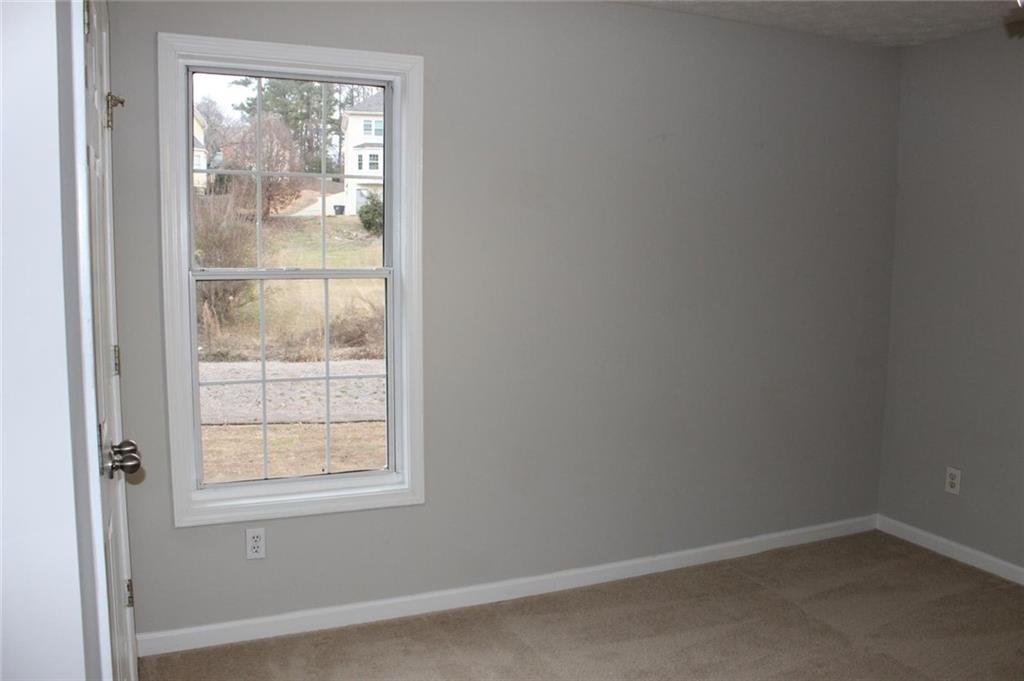 1250 Springmont Court Lawrenceville, GA 30043 - Photo 9 of 16 an empty room with a window