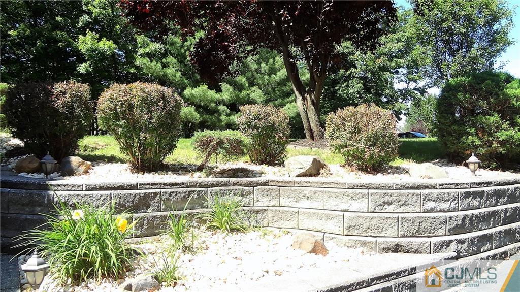 5 Verdi Road Monroe Township, NJ 08831 - Photo 3 of 25 a white bath tub sitting in a middle of a yard