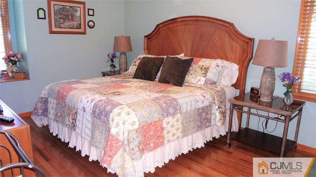 5 Verdi Road Monroe Township, NJ 08831 - Photo 21 of 25 a bedroom with bed and wooden floor