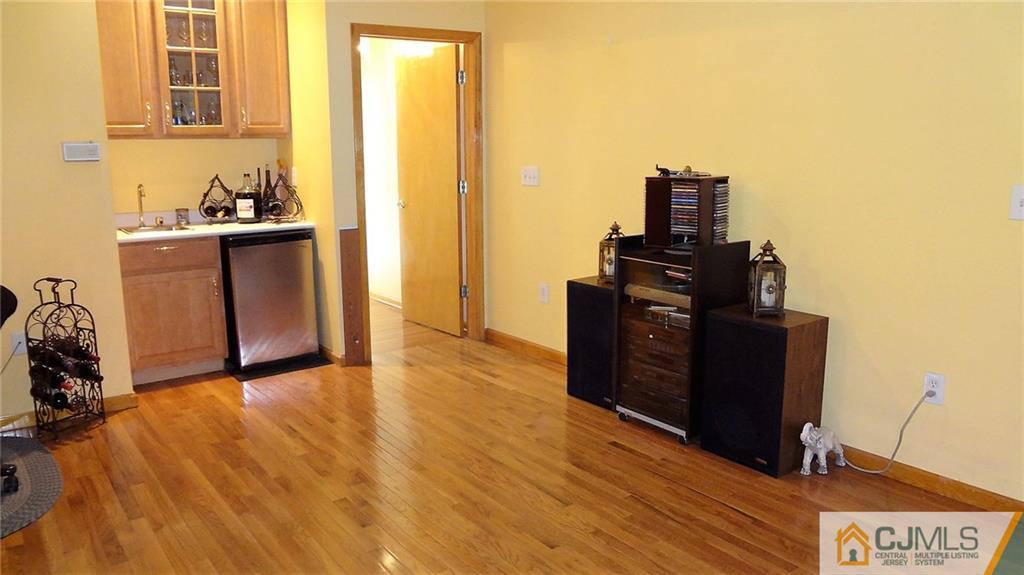 5 Verdi Road Monroe Township, NJ 08831 - Photo 23 of 25 a view of a kitchen with refrigerator and wooden floor