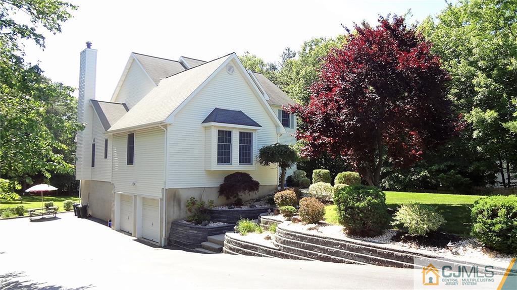 5 Verdi Road Monroe Township, NJ 08831 - Photo 24 of 25 a view of a house with backyard and sitting area