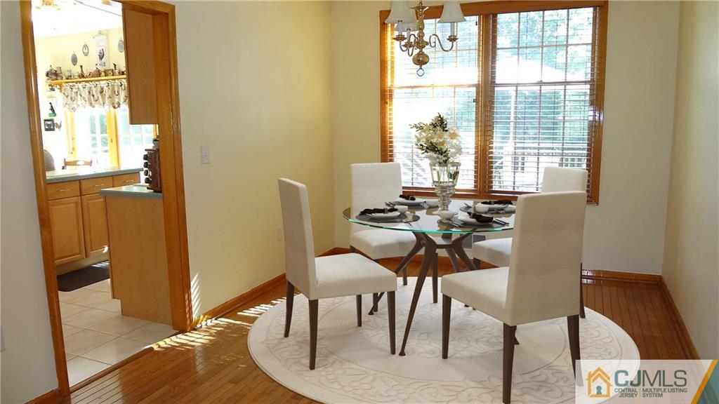 5 Verdi Road Monroe Township, NJ 08831 - Photo 9 of 25 a view of a dining room with furniture and a window