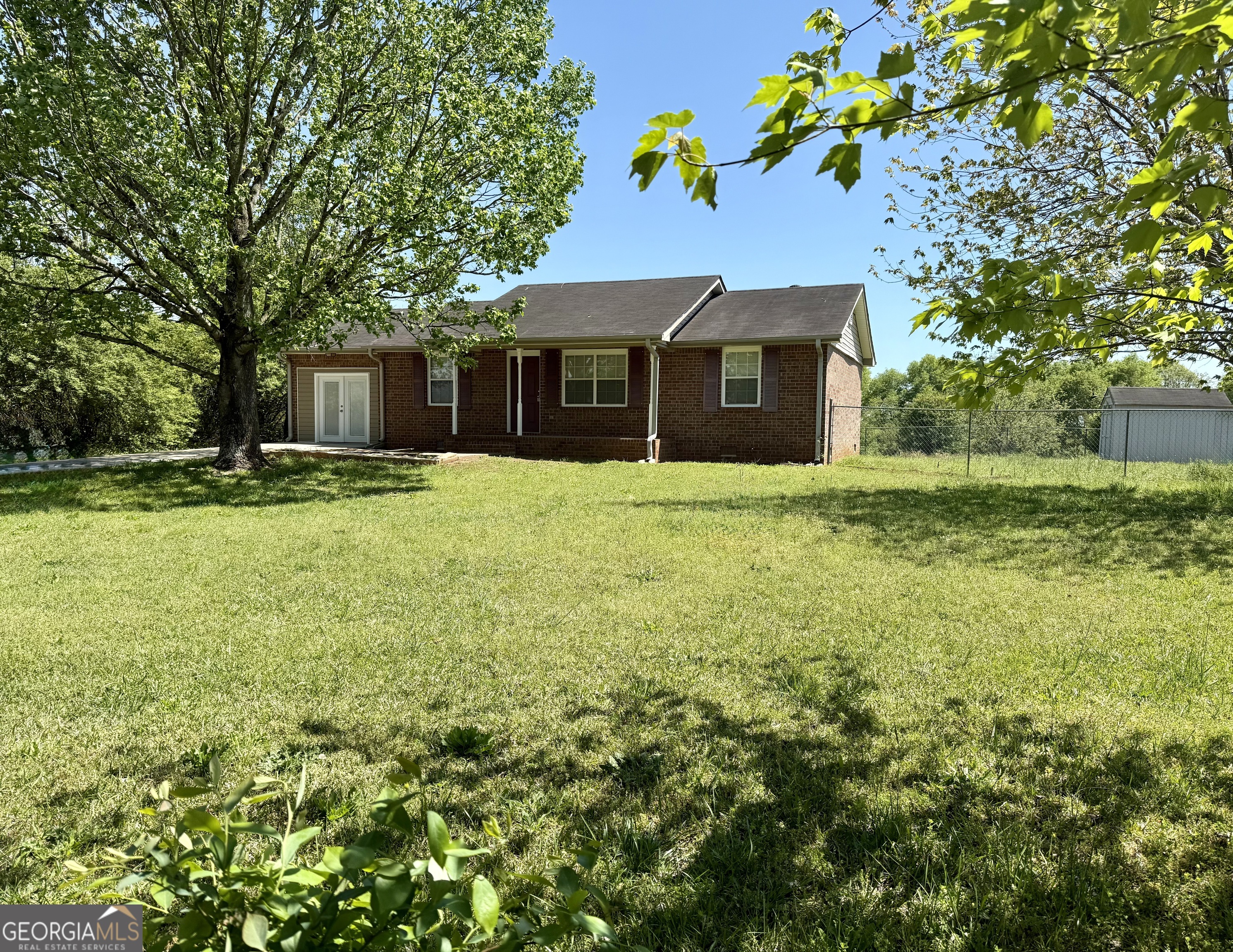 419 Rawls Road Williamson, GA 30292 - Photo 1 of 1 a house that is sitting in the grass