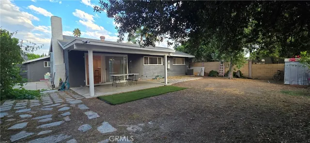 a view of a backyard with a patio