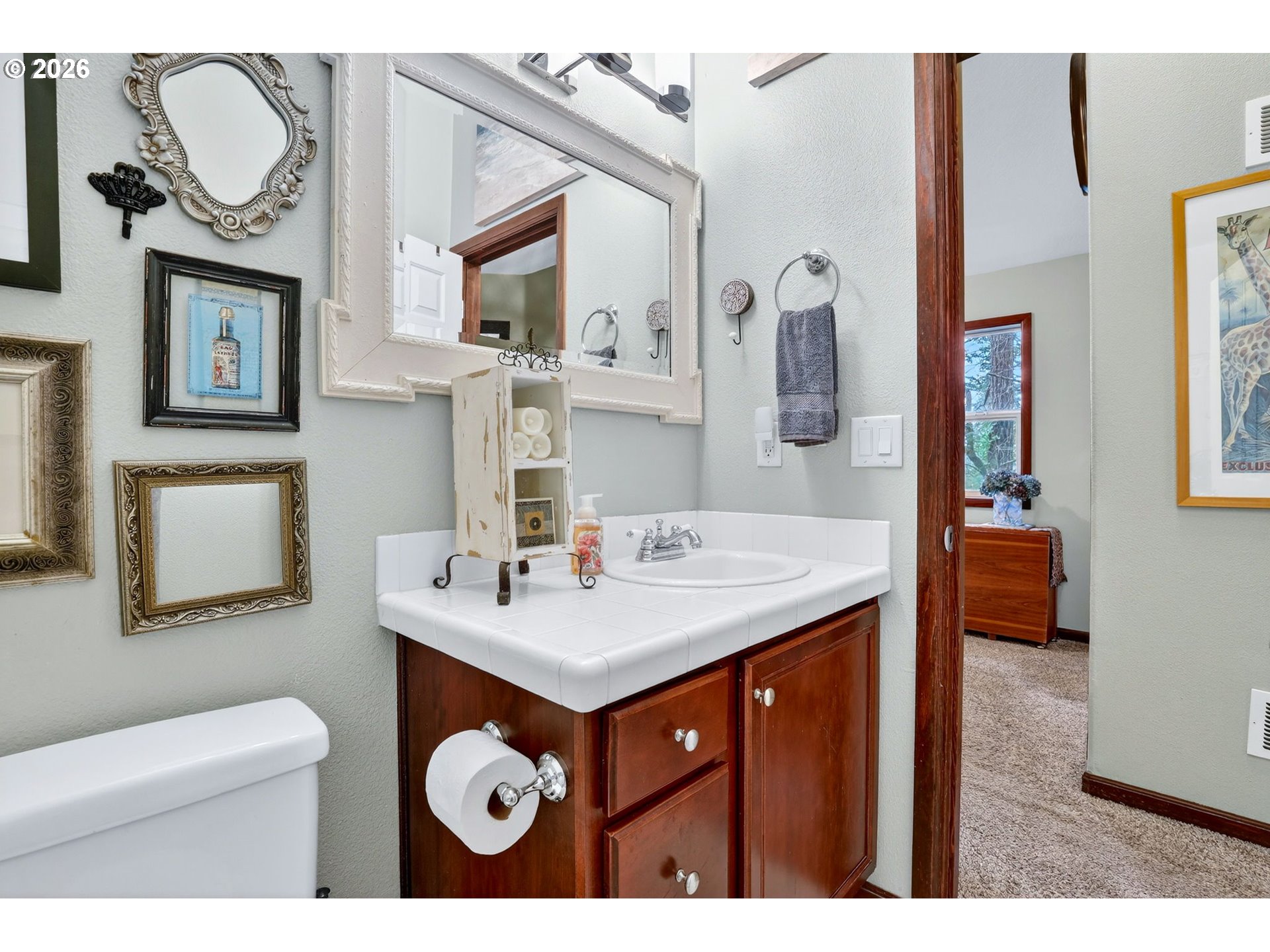 810 East 9th Street, Unit D13 Newberg, OR 97132 - Photo 30 of 42 a bathroom with a sink a toilet and mirror
