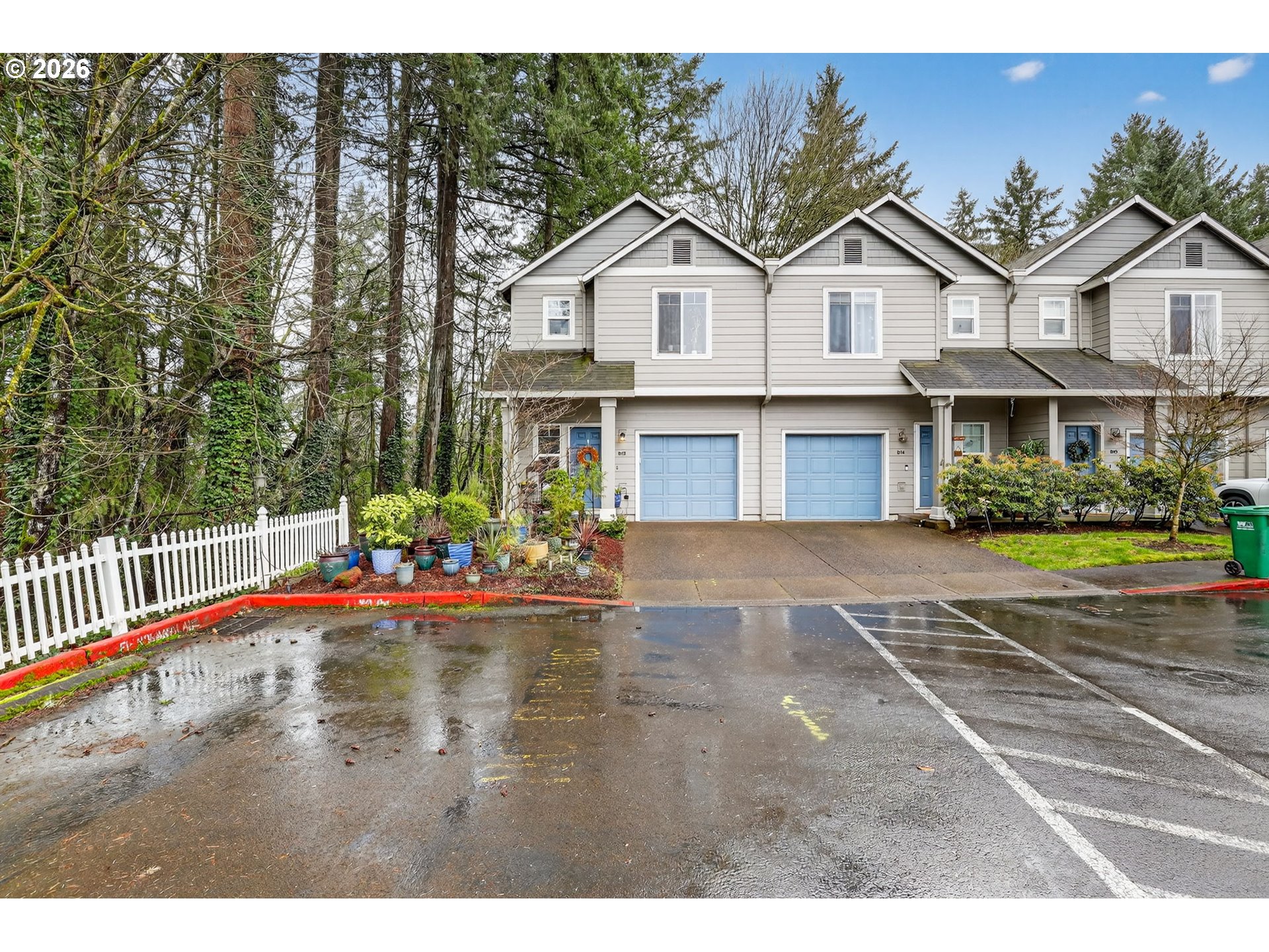 810 East 9th Street, Unit D13 Newberg, OR 97132 - Photo 3 of 42 a view of a white house with a chairs in a patio