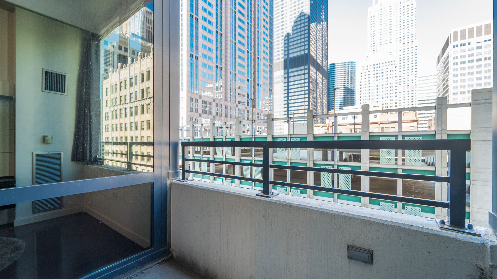 235 West Van Buren Street, Unit 1519 Chicago, IL 60607 - Photo 10 of 10 a view of a large window with a balcony