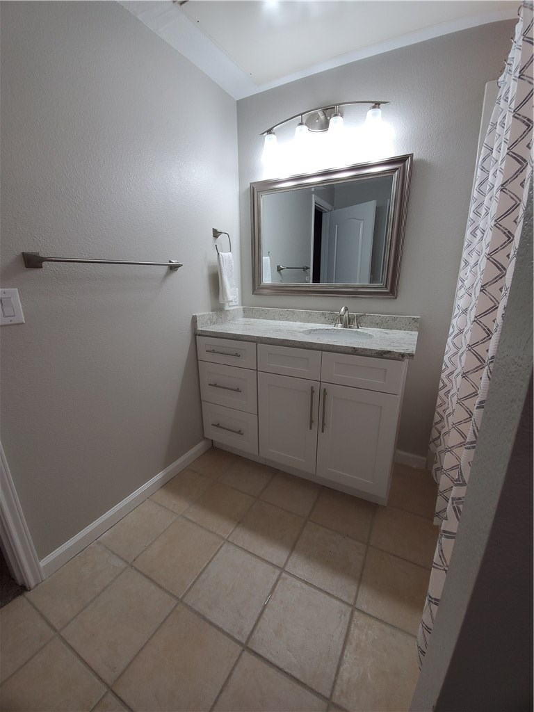 11203 Ranch Road 2222, Unit 302 Austin, TX 78732 - Photo 12 of 18 Master bathroom with updated vanity & counter, mirror and lighting