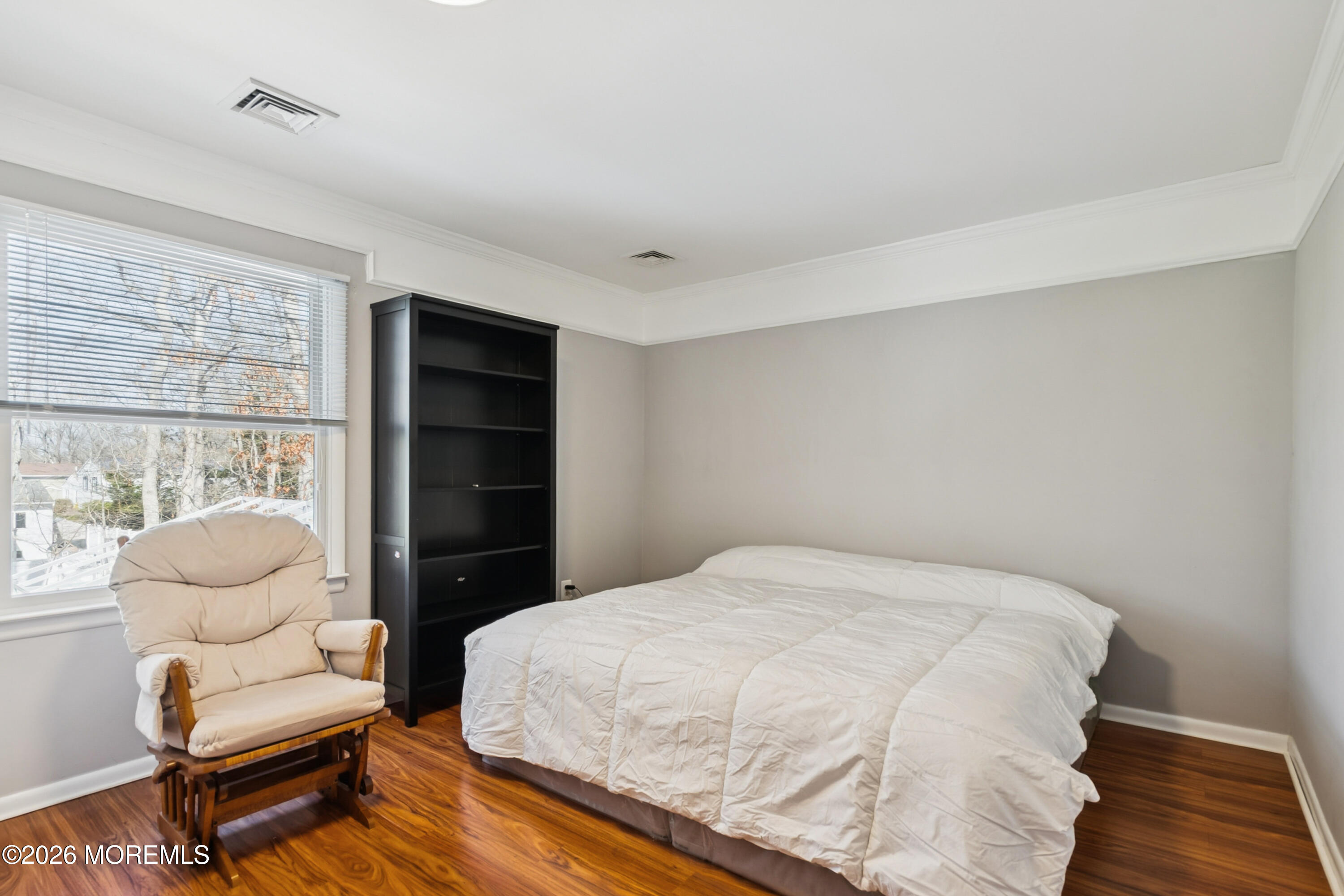 5 Liberty Court Howell, NJ 07731 - Photo 18 of 30 a bedroom with a bed and a chair
