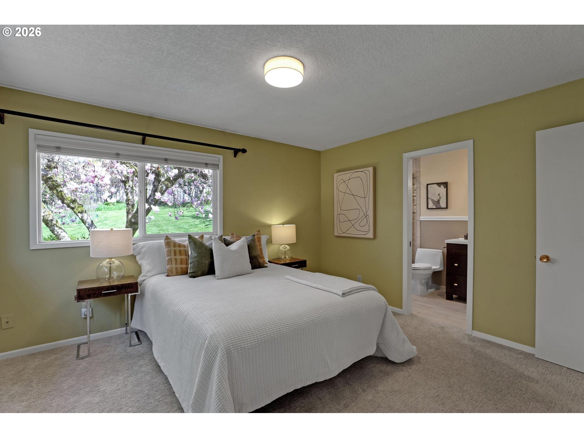 7021 Southwest Canyon Lane Portland, OR 97225 - Photo 11 of 25 a bedroom with a bed and a lamp on table