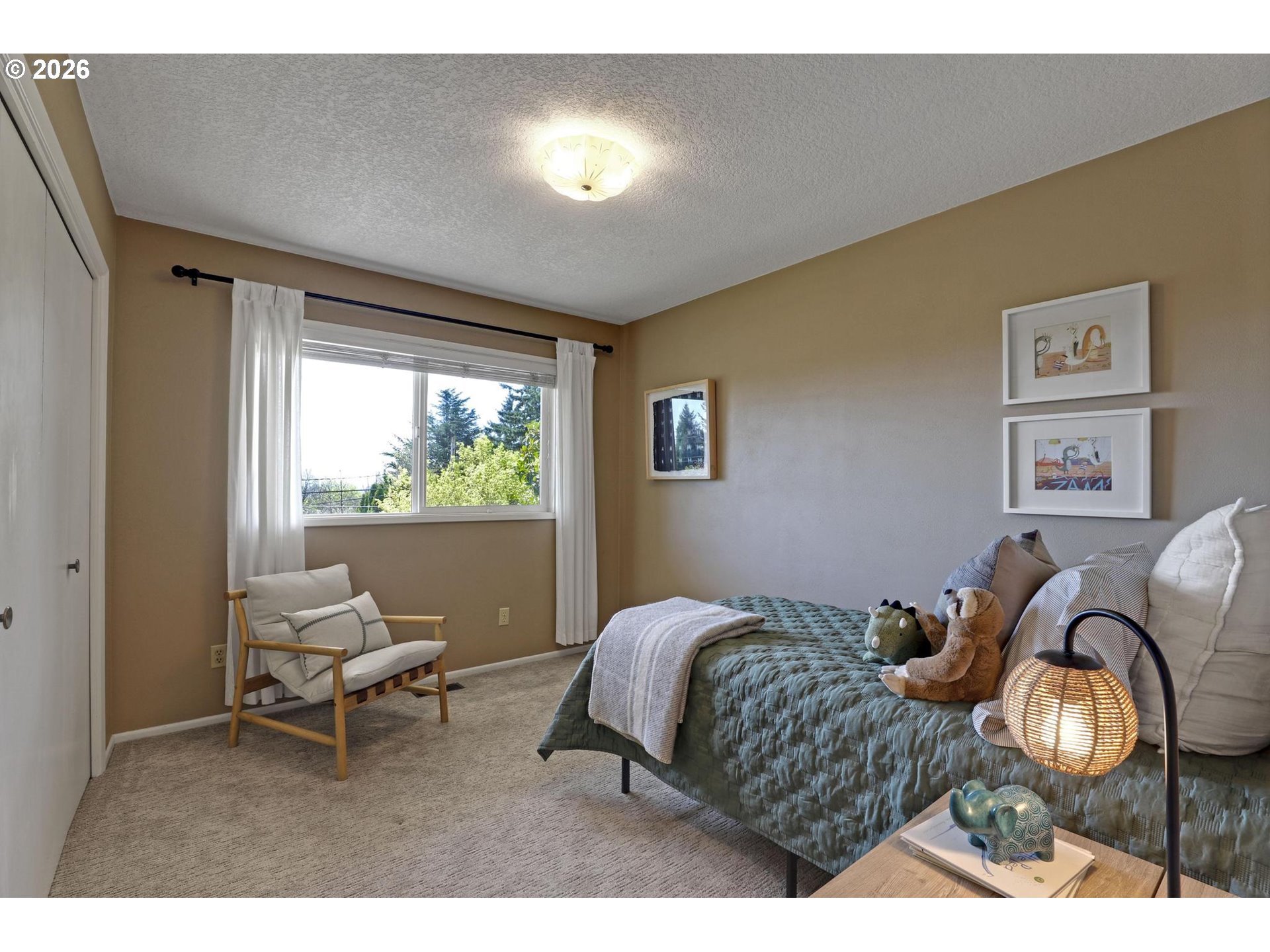 7021 Southwest Canyon Lane Portland, OR 97225 - Photo 13 of 25 a bedroom with a bed and glass windows